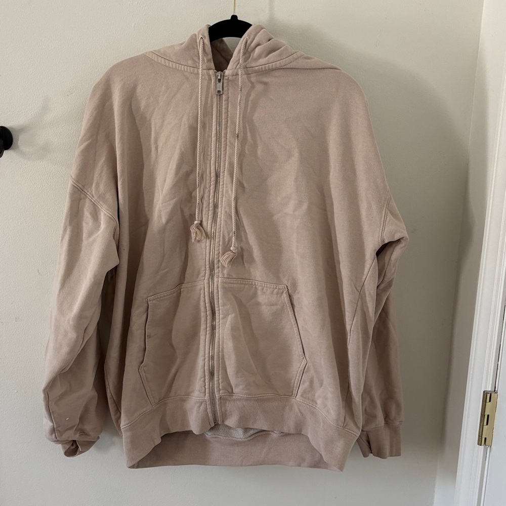 Beige “Brandy Melville” hoodie, size large.